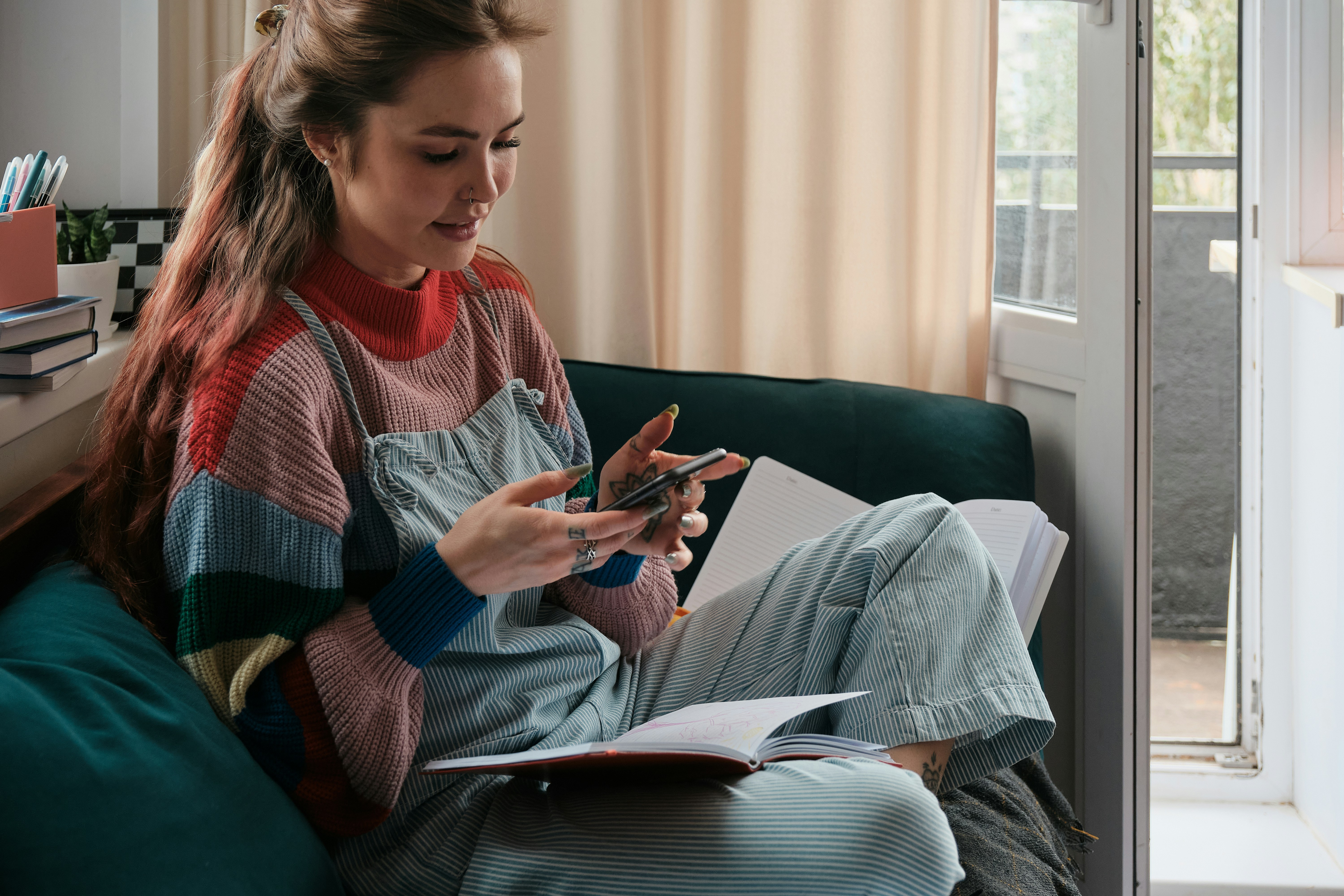 Student browsing listings on phone from her apartment